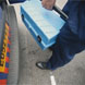 Image showing a British Gas Engineer lifting a toolbox into his van